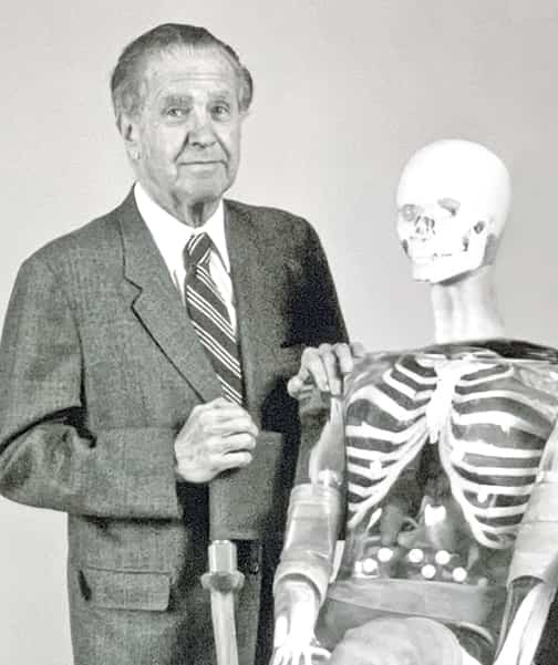Archival black-and-white photograph of RSD founder Samuel W. Alderson standing beside a Pixy anthropomorphic phantom